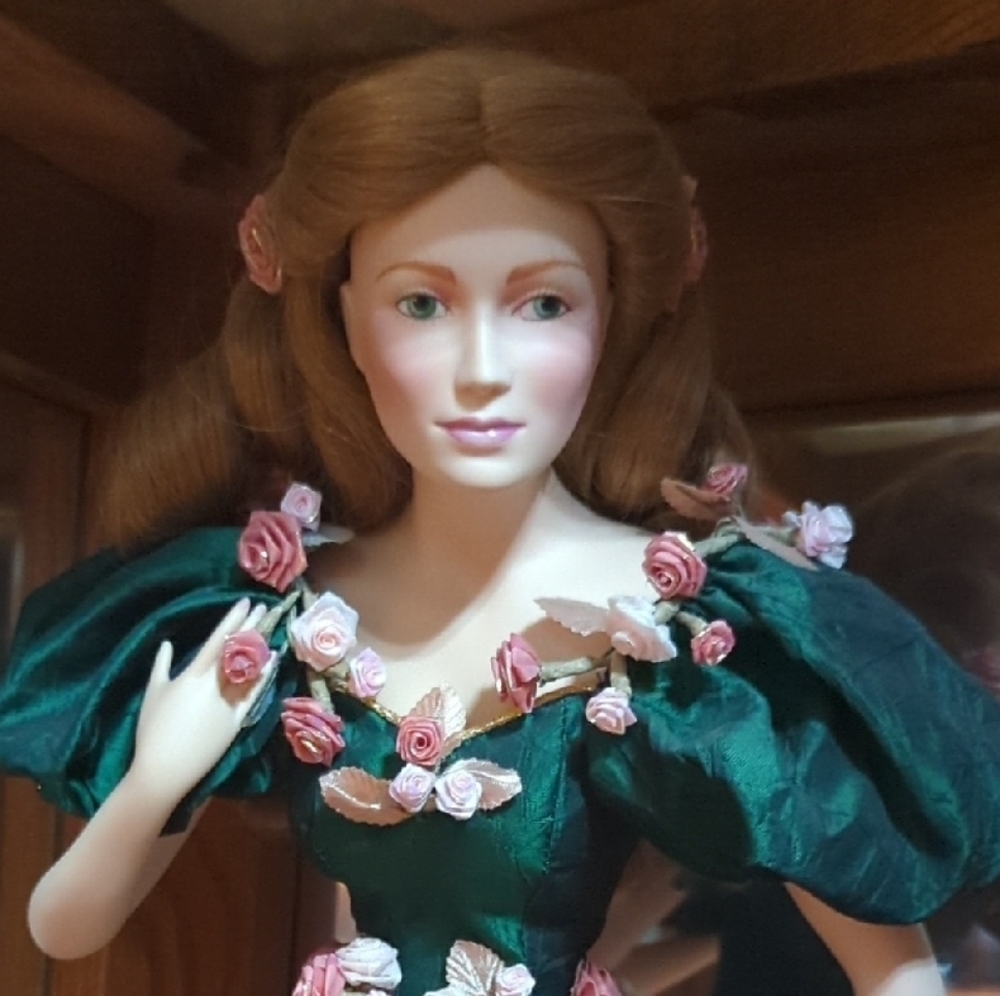 Elegant Green and Pink Porcelain Doll